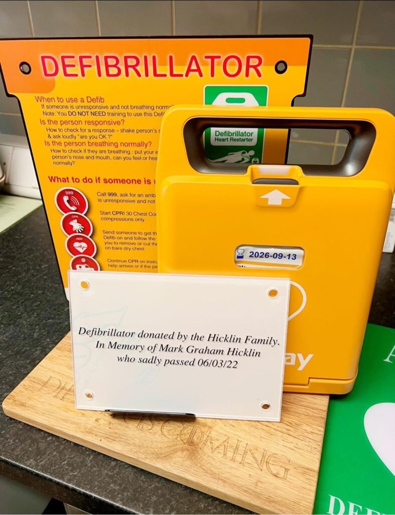 A memorial defibrillator plaque